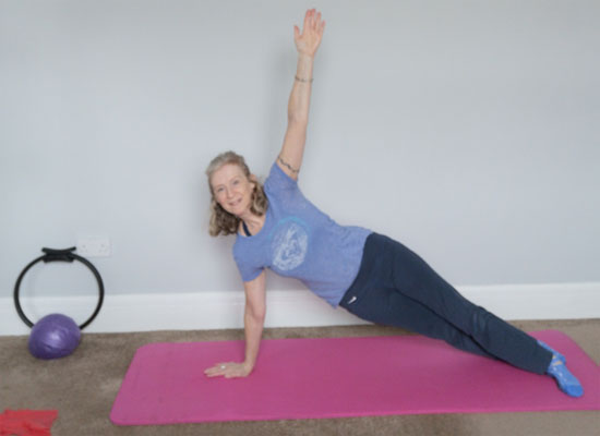 Claire teaching an online Pilates class