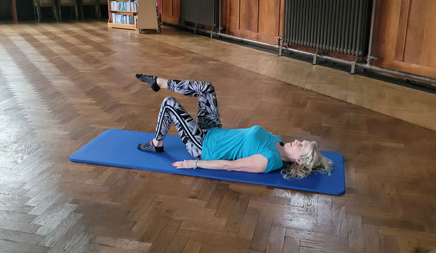 Claire the instructor doing a Pilates pose